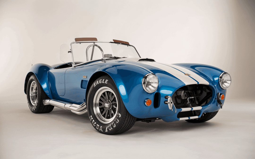 Blue 1960s Shelby Cobra 427 with white racing stripes, a rare American classic