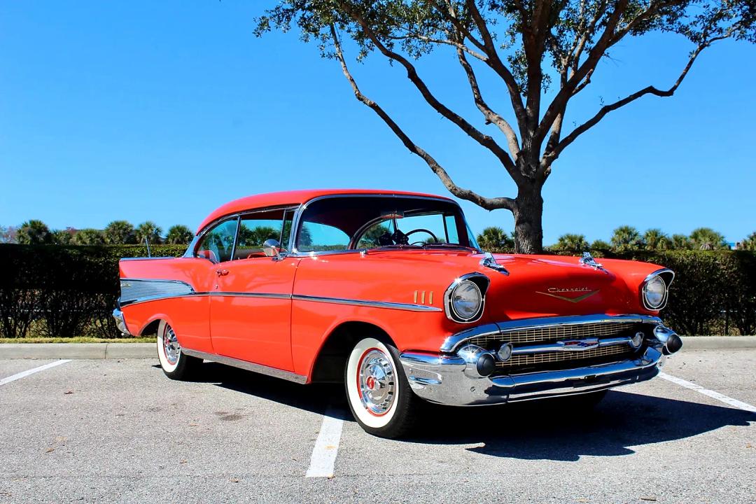 1957 Chevrolet Bel Air Sport Coupe in red with whitewall tires