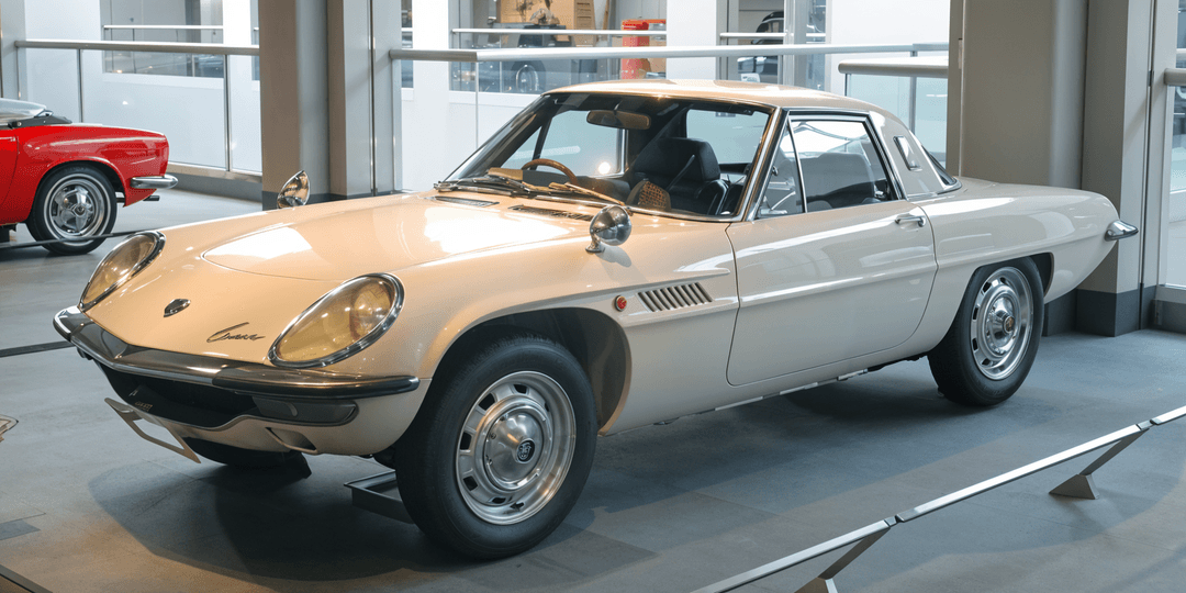 Mazda Cosmo Sport in silver, a rare 1960s car featuring a rotary engine