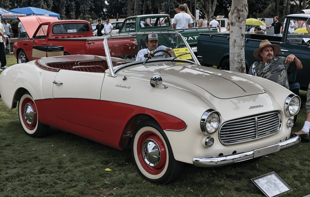 Datsun Fairlady in white, a classic Japanese roadster from the 1960s