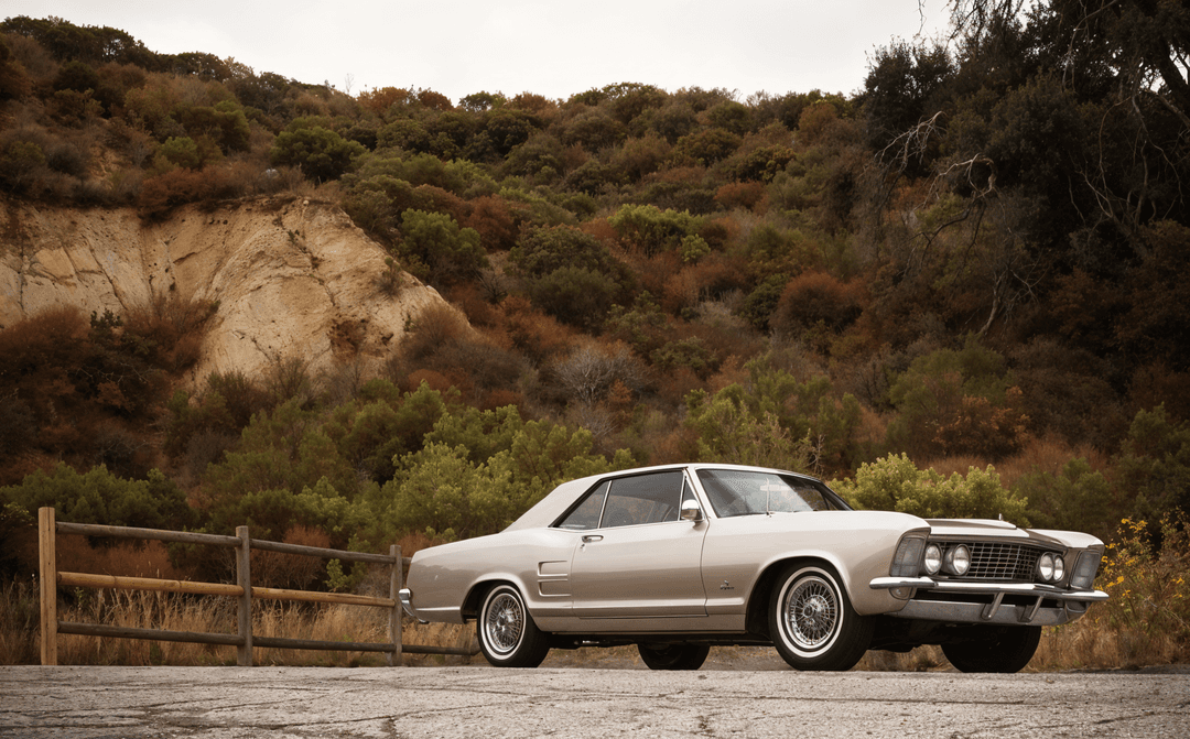 Buick Riviera GS in metallic blue, an American luxury car from the 1960s