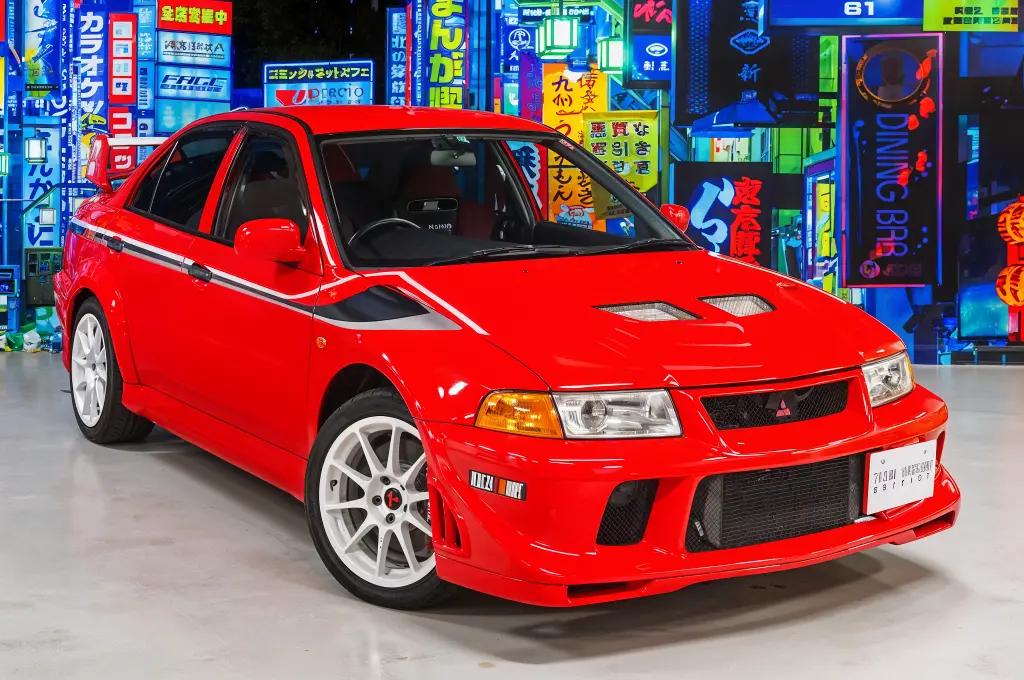 Red Mitsubishi Lancer Evolution VI TME with a rally-inspired design