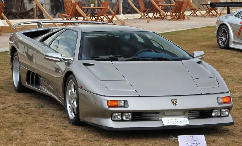 GrayLamborghini Diablo VT parked with its scissor doors open, showcasing its exotic appeal
