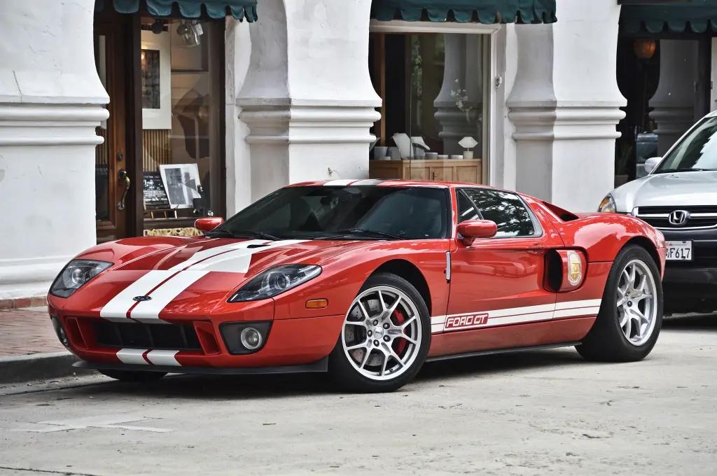 Ford GT in blue with white racing stripes, a modern homage to the GT40.