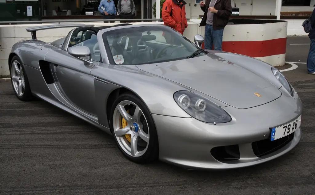 Porsche Carrera GT in silver, showcasing its sleek, aerodynamic body and low stance