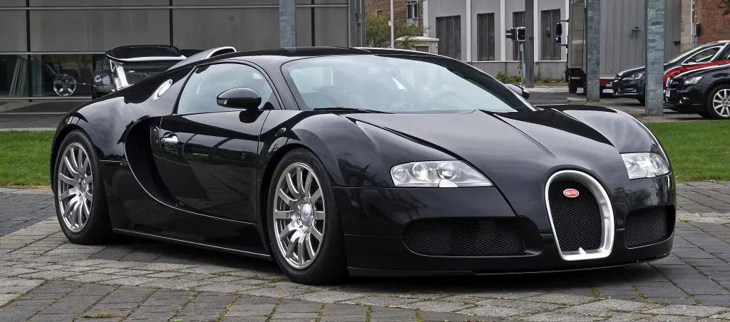Bugatti Veyron 16.4 hypercar with a striking two-tone finish, parked on a scenic road